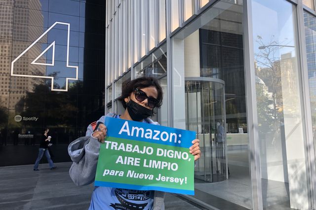 A member of Make the Road New Jersey protests a deal, then under consideration, to bring an Amazon hub to Newark airport on October 21, 2021. The deal has since been scrapped.